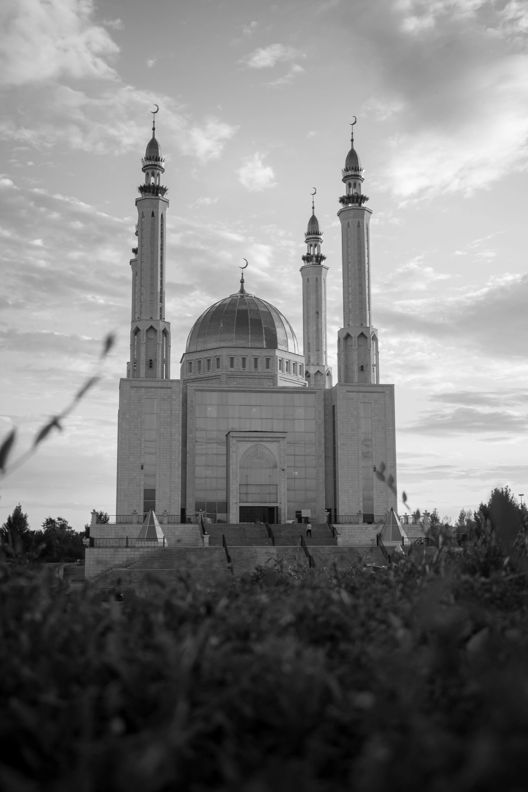 Mosque minarets at dusk, in black and white